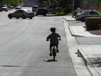 10-riding_the_bike_down_the_street