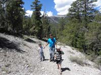 15-Beeja_Billy_and_Kenny_on_the_trail_with_Mummy_Mountain_in_background