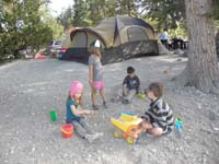 17-Ainsley_Zoe_Ethan_and_Kenny_playing_in_the_dirt-Sean_and_Amy's_monster_tent