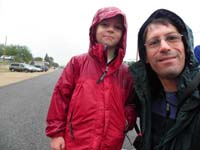 23-Kenny_and_Daddy_waiting_in_Cannonville_for_Mommy_to_finish-drizzling-we_have_raincoats