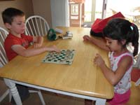 60-Kenny_and_Sarena_play_checkers_when_we_got_home