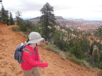 02-Kenny_being_coy_about_having_his_picture_taken_with_Bryce_Canyon_in_the_background_while_on_the_trail