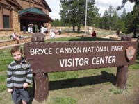 40-Kenny_showing_off_his_pin_in_front_of_Bryce_Canyon_NP_Visitor_Center