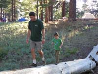15-Daddy_shows_Kenny_how_to_walk_on_the_log_by_our_campsite
