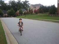 25-Kenny_riding_his_bike