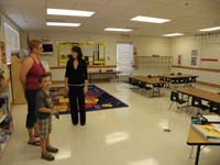06-Kenny_visits_his_kindergarten_classroom-meets_his_teacher_Miss_Kottraba-picks_his_seat_and_cubby