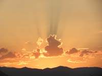 12-interesting_light_ray_on_clouds_during_sunset-driving_to_play_Cosmic_Miniature_Golf