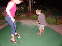 18-Kenny_needs_help_getting_in_the_hole-Mommy_uses_feet_as_barrier_to_assist