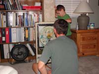 74-now_Daddy's_turn-Kenny_watches_the_balls_up_top_to_make_sure_there_is_enough_to_play