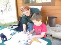 06-signing_his_Mt_Charleston_Junior_Ranger_certificate