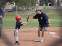 17-Daddy_using_his_had_as_the_ball_for_Kenny_to_hit-get_him_confident_hitting,then_later_work_on_right_technique