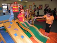 14-kids_got_to_pick_a_costume_to_wear-Kenny_picked_fireman-slide_fun