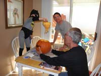 23-Kenny_Daddy_and_Poppy_carving_pumpkins-Kenny_pulling_out_the_guts