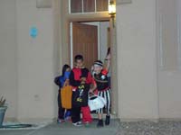31-Kenny's_having_fun_trick-or-treating_with_his_friends_next_door-Cash_and_Aiden