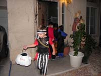 34-having_lots_of_fun-lots_of_good_years_with_the_bag,last_year_for_pirate_costume-little_small_this_year