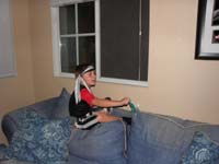 42-Kenny_waiting_by_the_window_for_kids_to_arrive-not_too_many-we_had_too_much_candy_left_over