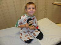 04-Kenny_in_his_hospital_gown_with_his_favorite-Sting
