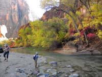 66-Kenny_throwing_sand_into_river-pretty_fall_colors