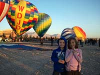 08-Kenny_and_Sierra_with_pretty_balloons-same_height,but_almost_two_years_apart-they_look_like_a_couple