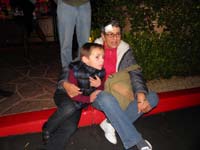 13-Kenny_and_Baba_sitting_on_the_curb_together_anticipating_the_parade