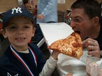 21-Daddy_sneaking_a_bite_of_Kenny's_pizza_at_Costco_after_last_baseball_game