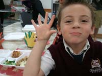 35-Kenny_showing_his_five_fingers_used_to_make_table_decorations
