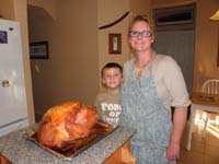 42-Kenny_and_Mommy_with_the_cooked_Thanksgiving_turkey