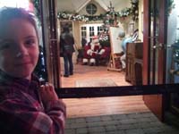 52-Kenny_excited_to_have_his_picture_taken_with_Santa_Claus_at_Town_Square