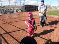 17-Kenny_walking_back_to_dugout_when_catcher's_gear_on