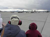 08-Baba_and_Kenny_admiring_P-51_and_two_F-22's