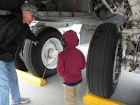 12-Poppy_showing_Kenny_the_B-52_tire_is_bigger_than_him