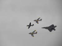 21-F-22_Raptor,F-86_Sabre(2),and_P-51_Mustang_Heritage_flight-WWII_Vietnam_Current