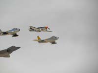 22-F-22_Raptor,F-86_Sabre(2),and_P-51_Mustang_Heritage_flight-WWII_Vietnam_Current