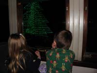 21-Kenny_looking_out_the_window_for_Santa_as_we_arrive_at_the_North_Pole