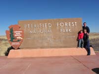 01-family_at_Petrified_Forest_NP_entrance.sign