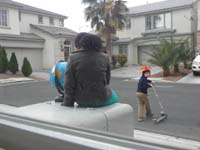 21-Kenny_even_takes_the_globe_outside_to_show_neighborhood_kids