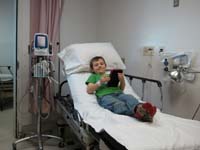 13-Kenny_in_very_good_spirits_at_emergency_room-He_couldn't_shake_the_croup,the_poor_thing