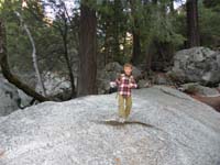 15-Kenny_having_fun_walking_on_rock-plastic_glove_for_Junior_Ranger_program_to_pick_up_trash