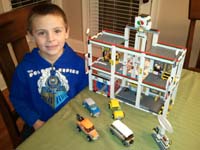 12-Kenny_and_the_finished_garage-8_bags_and_a_working_elevator-Mommy_only_helped_tie_rope_for_crank