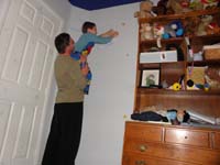 03-Daddy_giving_Kenny_a_lift_to_put_a_star_sticker_up_high