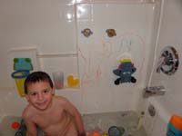 33-playing_in_the_tub-he_likes_using_his_bathtub_markers