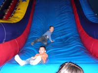 46-fun_at_Pump_It_Up-Kenny_and_JR_on_the_slide