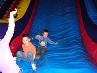 47-fun_at_Pump_It_Up-Kenny_and_JR_on_the_slide
