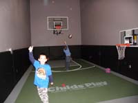 55-Child's_Play_fun-Travis_and_Kenny_shooting_baskets