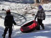 39-Kenny_and_Abbe_pulling_the_tube_uphill