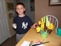 14-Grammy_and_Grandpa_Duke_sent_an_edible_arrangement_since_they_couldn't_be_there_to_give_hug