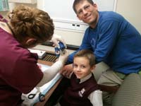 23-Daddy_holding_Kenny's_hand_up_while_the_cast_is_rolled_onto_his_hand