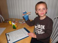 26-so_we_came_up_with_idea_to_use_rubberband_to_hold_pencil_to_augment_lack_of_use_of_his_thumb-worked_very_well