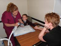 59-time_to_cut_the_cast_off-at_first_Kenny's_a_little_scared_so_Mommy_holds_his_hand