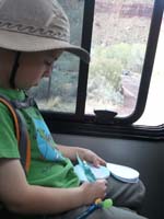 03-Kenny_taking_notes_about_what_he_sees_while_on_the_shuttle_bus